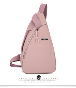 Detailed side view of mauve nylon crossbody bag featuring LSNR metal logo and durable zipper