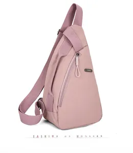 Detailed side view of pink nylon chest bag featuring a triangular design and LSNR logo
