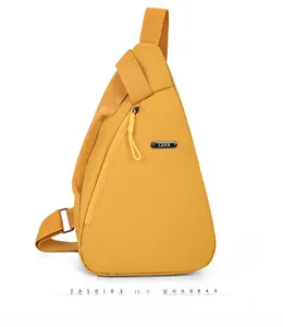 Detailed front view of mustard yellow nylon crossbody chest bag with LSNR metal logo