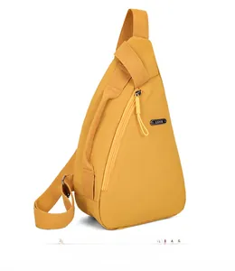 Macro view of a yellow nylon crossbody sling bag showing the LSNR metal brand plate