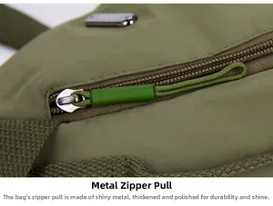 Macro shot of durable crossbody bag zipper with polished metal and green braided puller