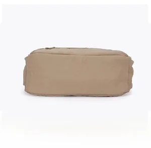 Detailed bottom view of a khaki lightweight nylon shoulder bag with soft stitched edges