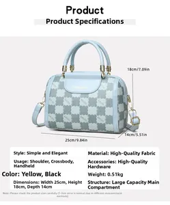 Detail showing blue Boston bag dimensions 25x18x14cm and adjustable shoulder strap