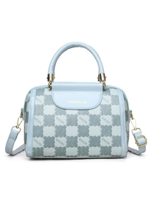Detail of light blue checkered Boston bag with golden hardware and top handles