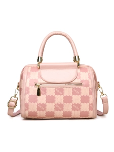 Detail of pink checkerboard boston bag with cloud patterns and golden hardware