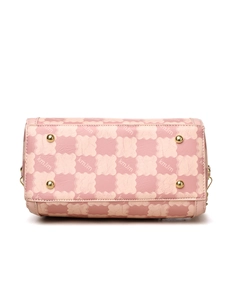 Detailed base view of pink and beige checkered handbag with gold protective studs