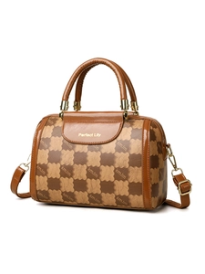 Detailed 45-degree angle of a brown checkered Boston handbag with gold hardware