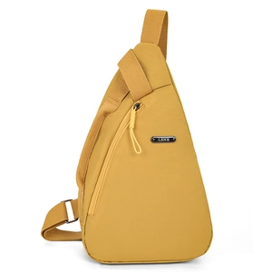 Bright yellow waterproof nylon sling bag with metal logo and adjustable strap