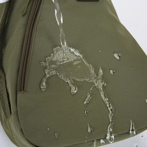 Waterproof dark green crossbody chest bag with moisture-resistant nylon fabric texture
