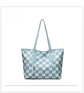 Front view of large blue tote bag with grey checkerboard pattern and KMJM letter print