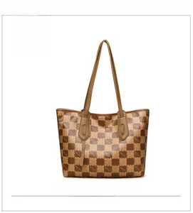 Front view of large brown tote bag with checkerboard pattern and KMJM monogram print