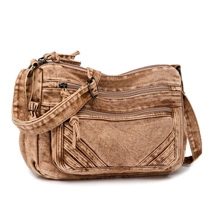 Detail of vintage brown canvas crossbody bag featuring multi-pocket utility design