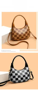 Detail view of checkerboard pattern Hobo bag with bear silhouette and kmJm print