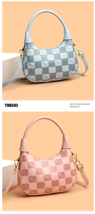 Detail of pink and blue hobo bags with bear silhouette print and gold hardware