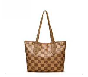 Rear view of large brown checkerboard tote bag with heart patterns and double handles