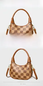 Detail view of the brown color-block Hobo bag showing patterned leather and gold hardware