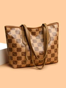 Close-up of brown checkerboard tote bag with bear motifs and kmJm branding detail