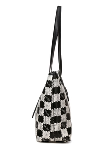 Detail view of large tote bag side profile featuring contrast cloud pattern and slim straps