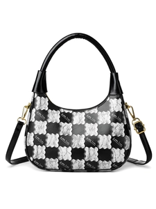 Detail of hobo bag with silver floral checkerboard pattern and gold metal hardware
