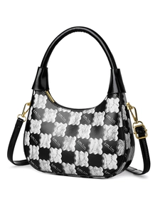 Detail of checkered hobo bag with contrast stitching, gold hardware and leather strap