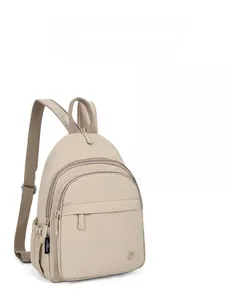 Detail of light beige nylon backpack showing functional front pockets and waterproof texture