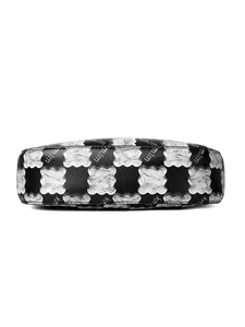 Detail shot of black pebbled leather and silver wavy-edge panel with mjm pattern