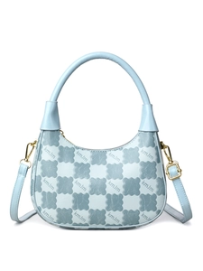 Close-up of the light blue crossbody bag featuring unique flower texture and golden metal hardware
