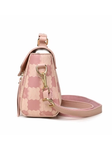Side view of pink crossbody bag with KM monogram print and golden metal hardware