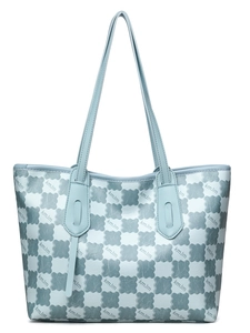 Detailed macro view of the light blue leather tote bag with KMJM cloud pattern print