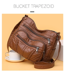 Detail view of brown PU leather bag with multi-pocket design and woven texture accents