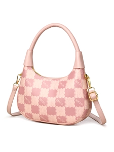 Detailed side view of pink checkered hobo bag with teddy bear pattern and gold hardware