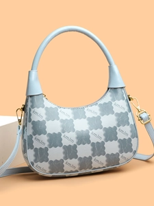 Detail of light blue hobo bag with checkered kmJm patterns and gold hardware hook