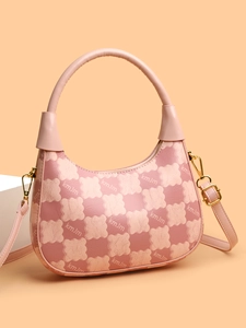 Detail of pink checkerboard leather crossbody bag with gold hardware and kmJm pattern