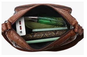Top view of deep brown quilted PU tote showing multiple compartments and large capacity