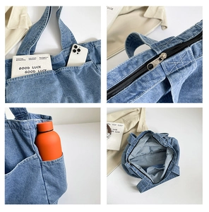 Detail view of denim tote bag showing multi-pocket storage and large internal capacity
