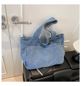 Close-up of vintage denim tote bag showing front pockets and BAILEYAO brand label