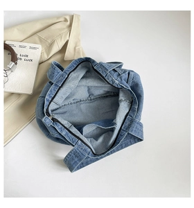 Top view of spacious denim tote bag interior showing inner pocket and durable material