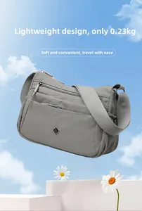 Lightweight grey nylon crossbody bag weighing only 0.23kg with multiple zipper pockets