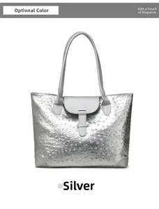 Close-up of silver tote bag with ostrich leather texture and buckle detail