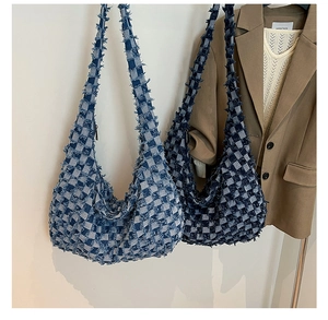 Detail of vintage denim hobo bags featuring distressed edges and checkerboard pattern
