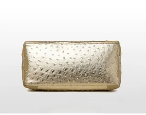 Detailed bottom view of large tote bag showing champagne ostrich texture and fine stitching