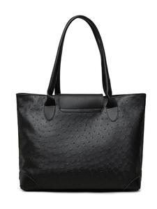 Detail of black ostrich embossed faux leather tote bag with long handles and flap decorative