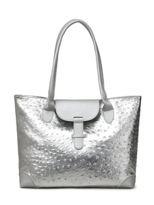 Macro shot of silver tote bag featuring ostrich embossed texture and front buckle detail
