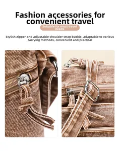 Detail of adjustable metal buckle and woven zipper puller on washed denim bucket bag