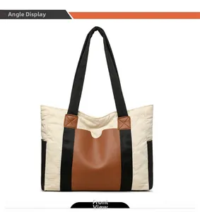 Detailed front view of tote bag featuring diamond quilted nylon and brown leather contrast