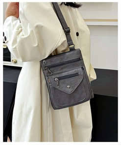 Detail of dark gray PU leather crossbody phone bag with multi-pocket zipper design
