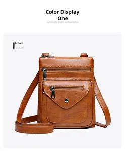 Front detail of brown vintage leather crossbody bag with multi-zipper layers and flap pocket
