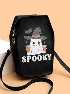 Detail of coffin-shaped crossbody bag with spooky ghost print and gold zipper