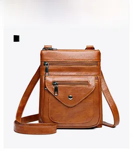 Front view of a brown vintage lychee grain leather crossbody bag with multiple zip pockets