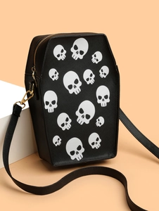 Close-up of coffin-shaped crossbody bag with skull prints and crossgrain faux leather texture